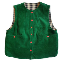 Load image into Gallery viewer, A green corduroy vest with red buttons, featuring a black and white gingham lining inside the collar and armholes, laid flat on a white background.