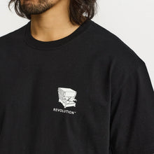 Load image into Gallery viewer, A close-up of a man wearing a black t-shirt with a white graphic of a box truck and the word 'REVOLUTION' printed on the left chest, against a plain light background.