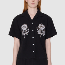 Load image into Gallery viewer, Black shirt with floral embroidery on a plain background