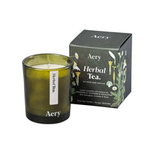 Load image into Gallery viewer, Osmology Herbal Tea candle and packaging on a white background